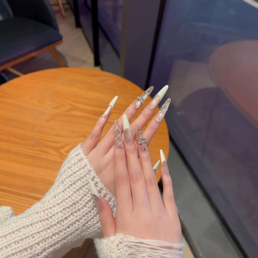 Elegant Stiletto Nail Extensions with Decorative Designs