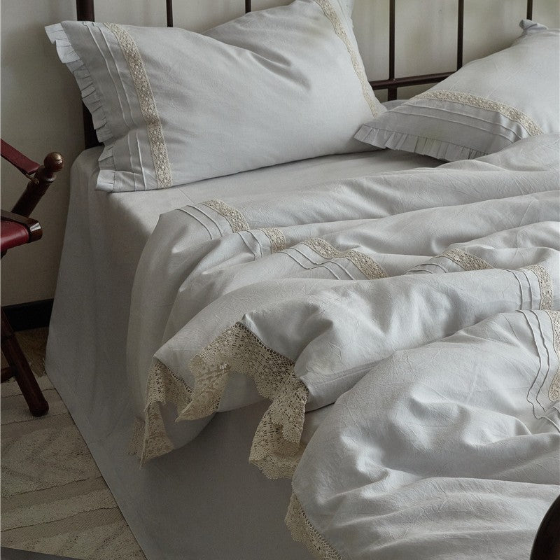 High-quality linen bedding set with handcrafted crochet lace, box pleats, and integrated bed skirt
