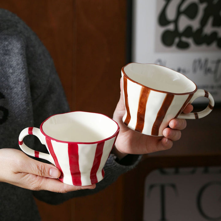 Designer stoneware coffee mug with scalloped rim and vertical brushstroke