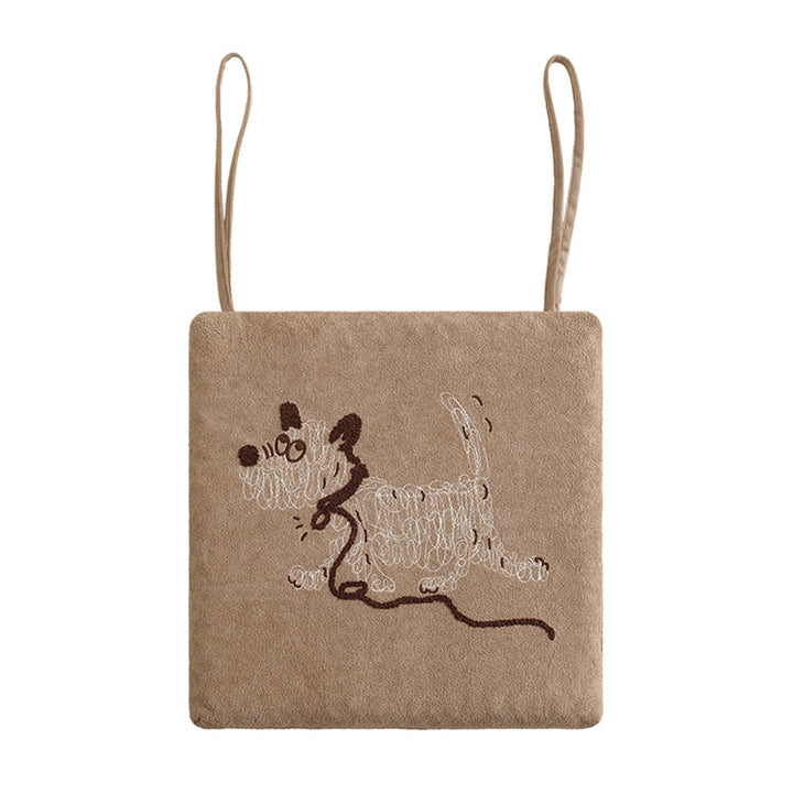Square seat cushion with ties and embroidered dog motif