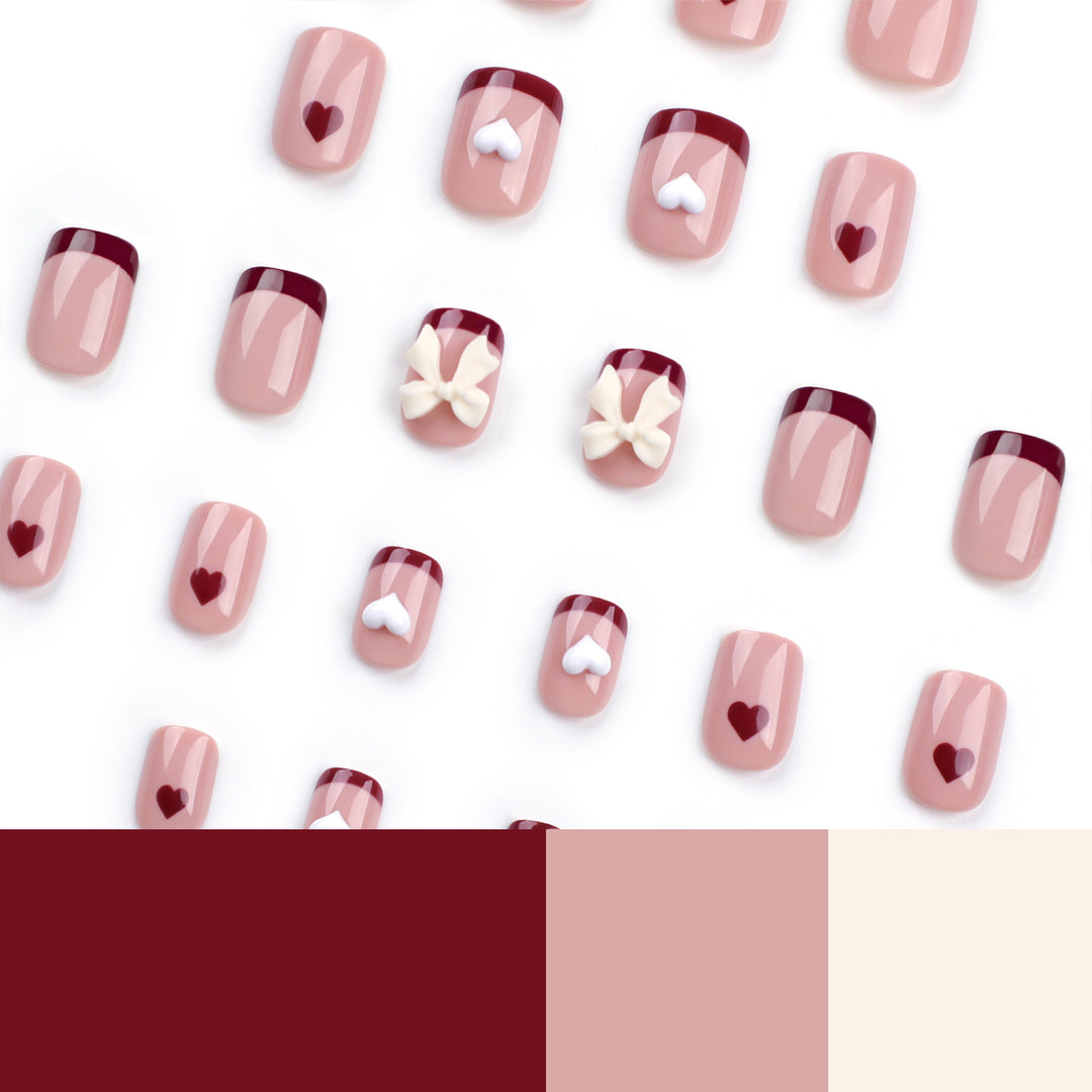 Artful nail art with heart and bow motifs Kalsten