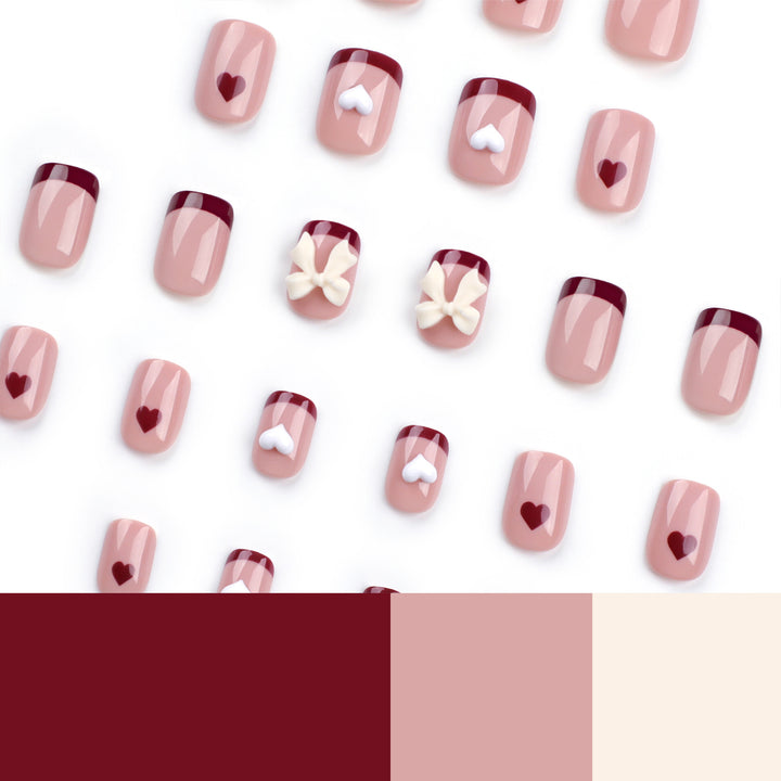 Artful nail art with heart and bow motifs Kalsten