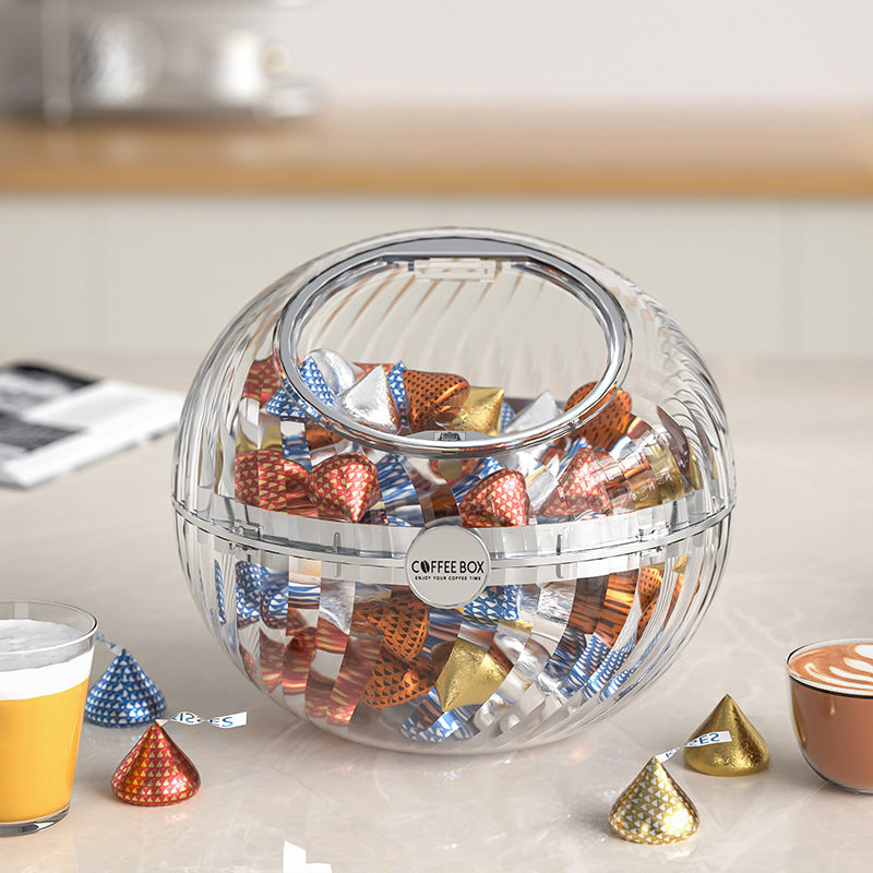 Spherical coffee capsule dispenser made of clear acrylic with flip lid
