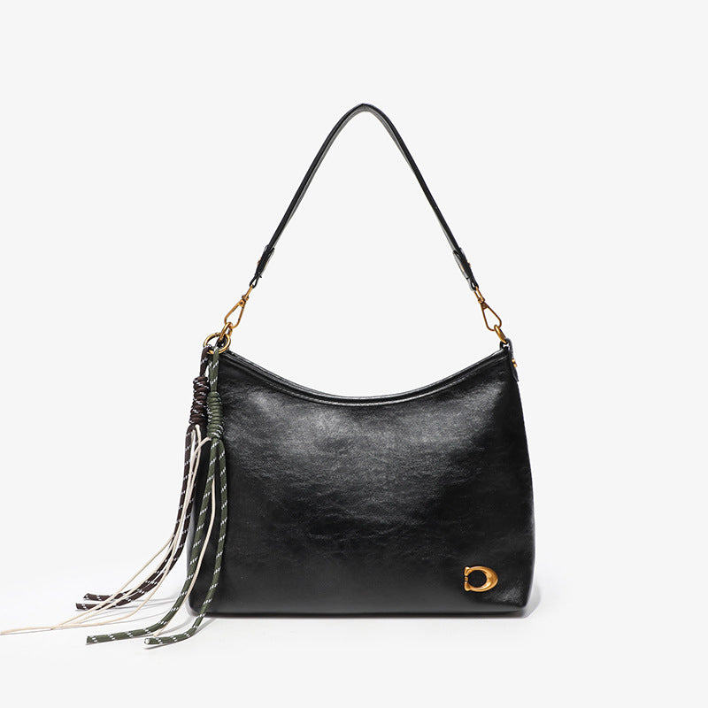 Elegant Hobo Handbag with Decorative Tassels