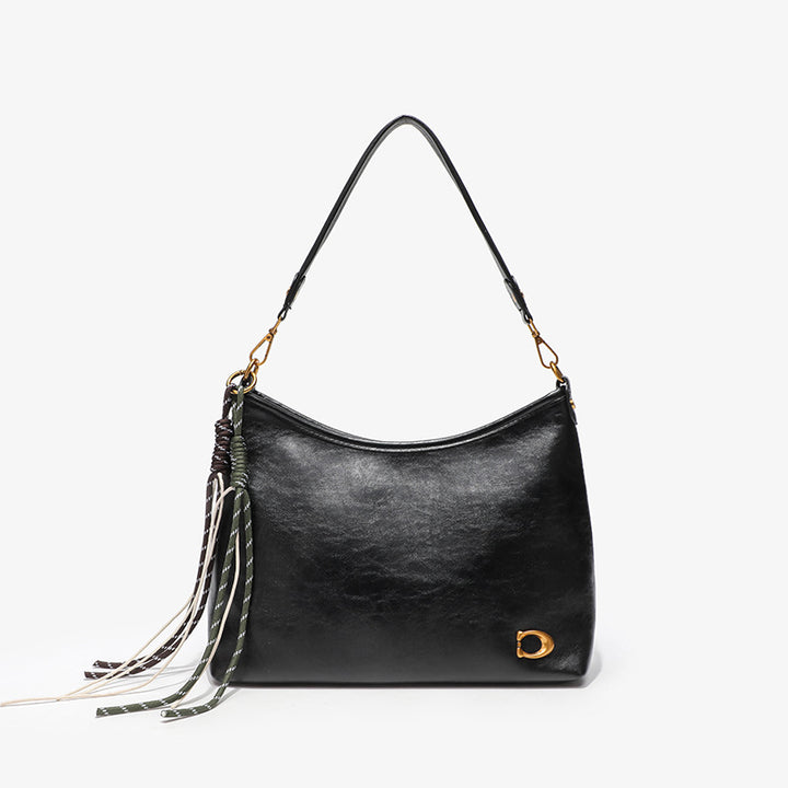 Elegant Hobo Handbag with Decorative Tassels