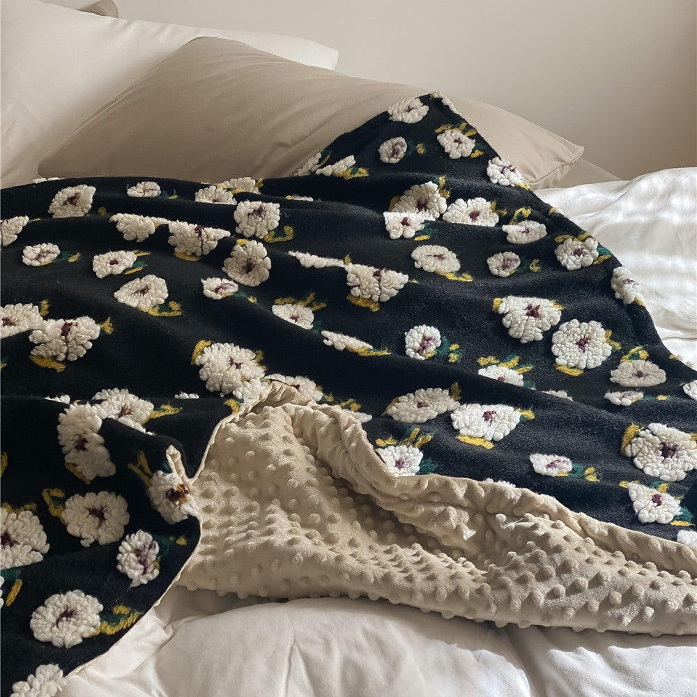 Cuddly blanket with floral bouclé surface and minky reversible fleece