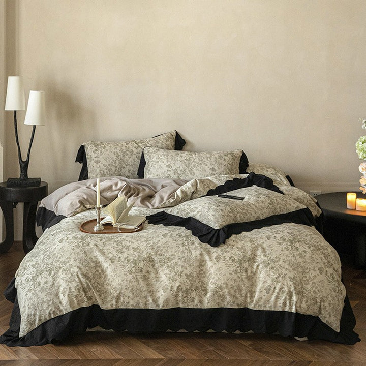 Bedding set with floral toile design and decorative lace trim