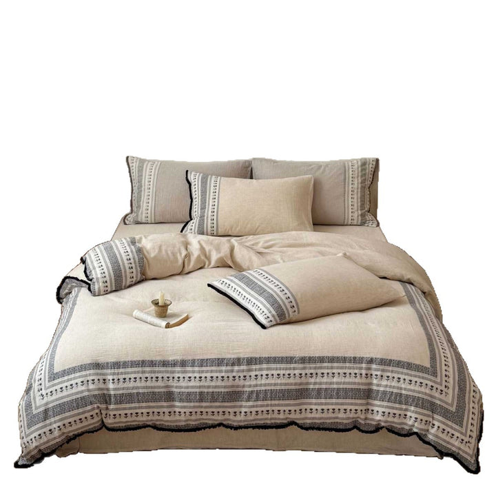 Country house style bedding set with striped floral border and fringes