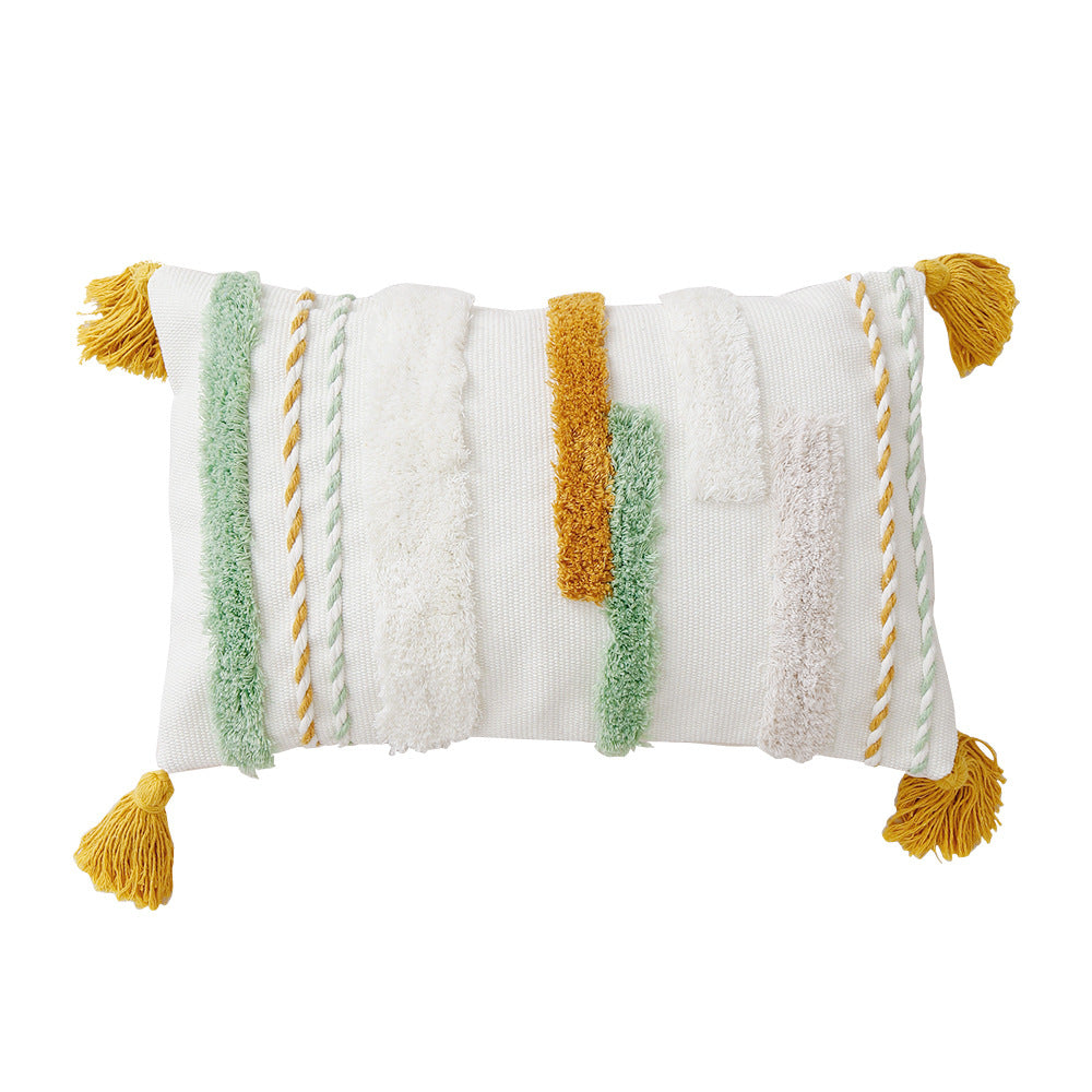 woven decorative cushion cover with tufted relief stripes and corner tassels