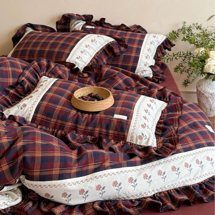 Checked bedding set in vintage cottage style with ruffle and embroidered border