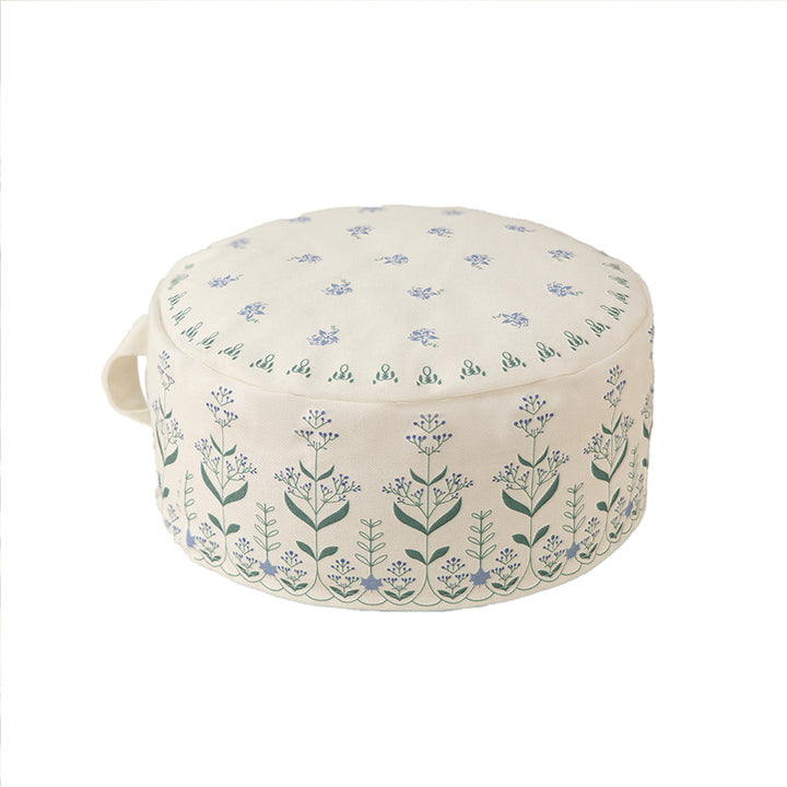 Round floor pouf with ethnic weaving pattern and practical carrying handle Kalsten