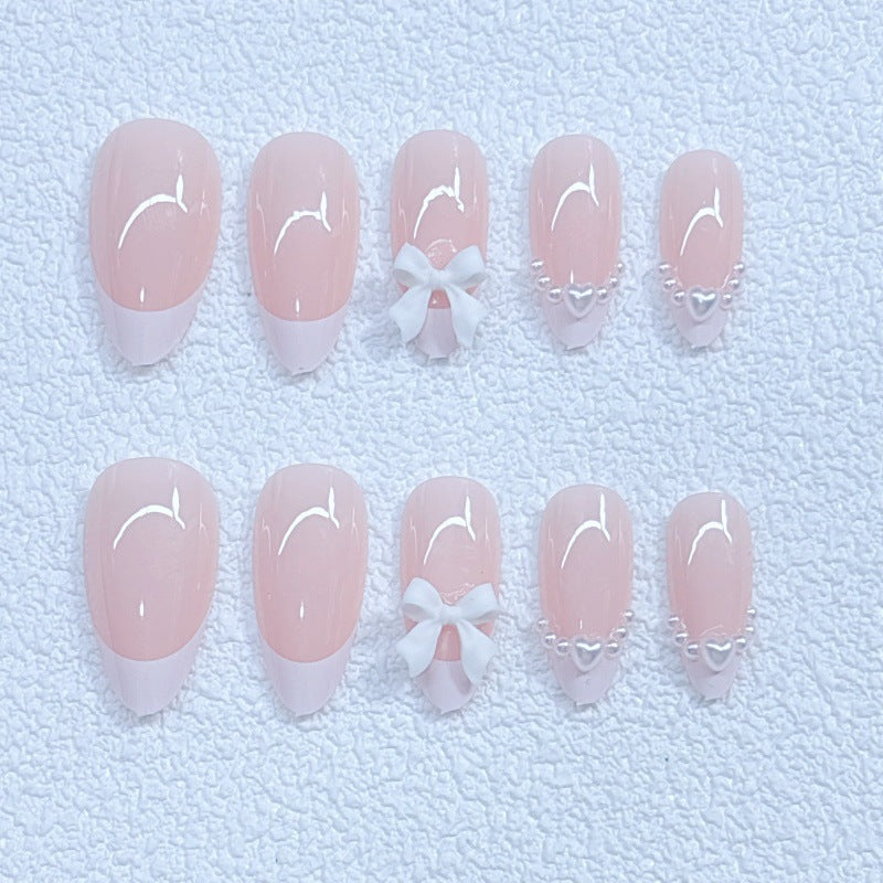 Elegant artificial nails with curved tips and decorative bows Kalsten