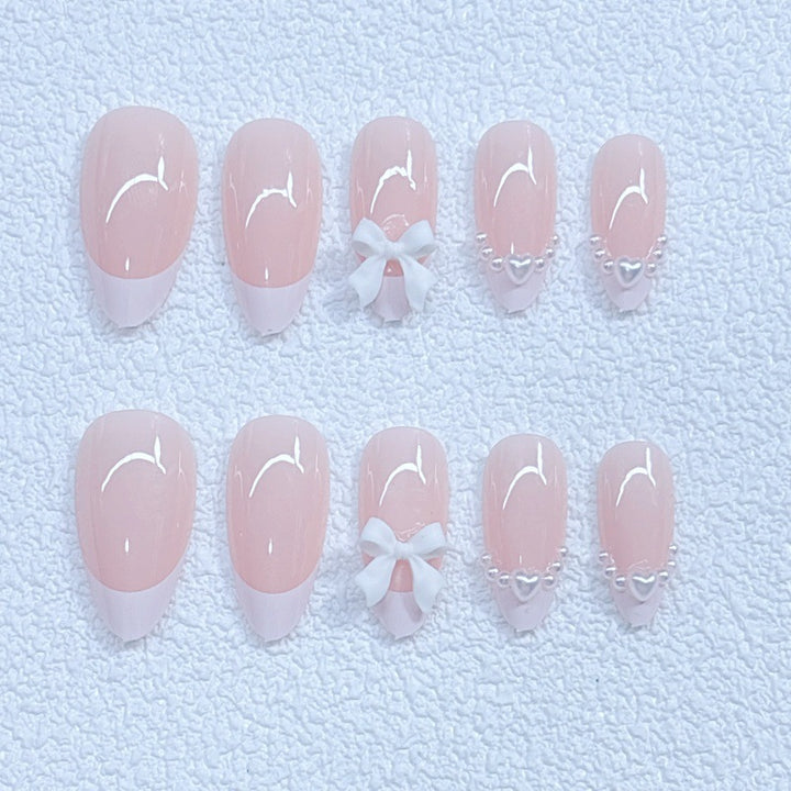 Elegant artificial nails with curved tips and decorative bows Kalsten