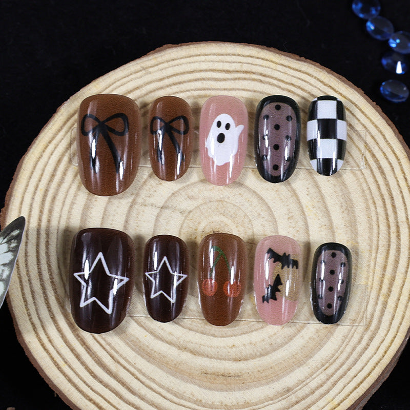 Artificial nail set with creative Halloween designs and glittering accents Kalsten