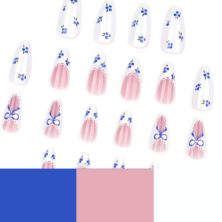 Artful nail art with floral accents and bow embellishment Kalsten