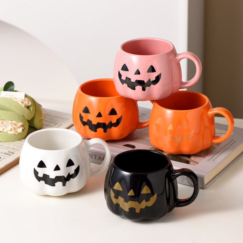 Ceramic mug in pumpkin shape with handle and carved face