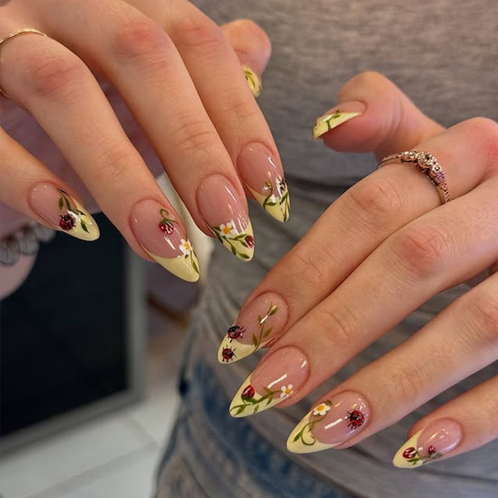 Artificial nail set with elegant gradient and floral accents Kalsten