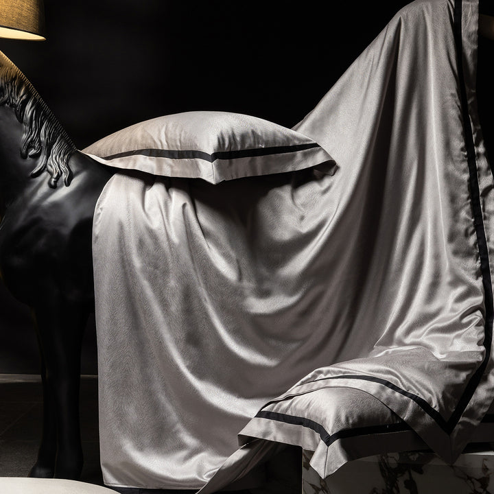 Luxurious satin bedding set with contrasting decorative trim
