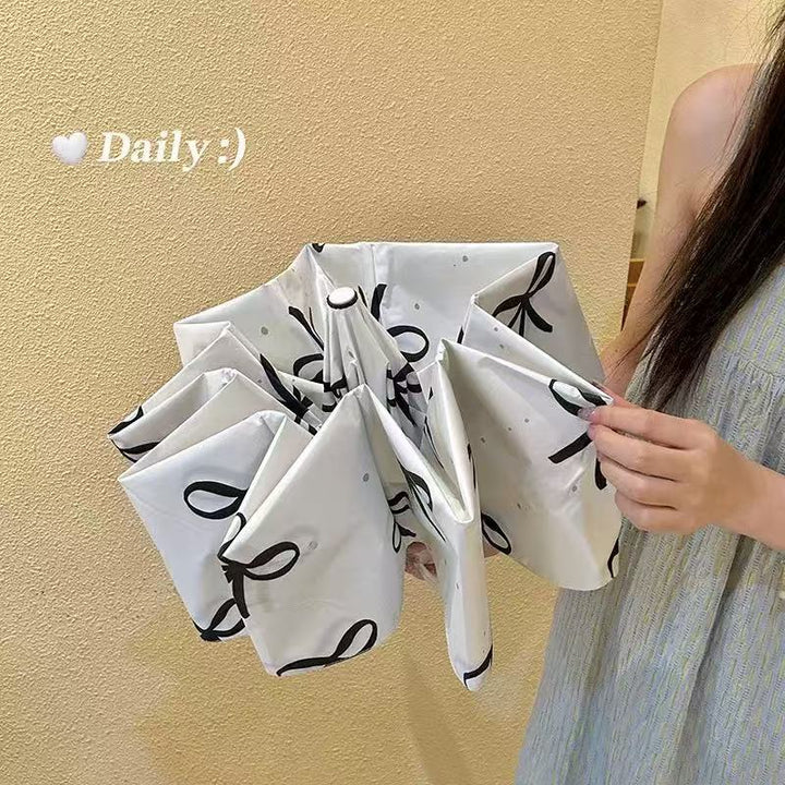 Women's foldable umbrella with elegant bow design Kalsten