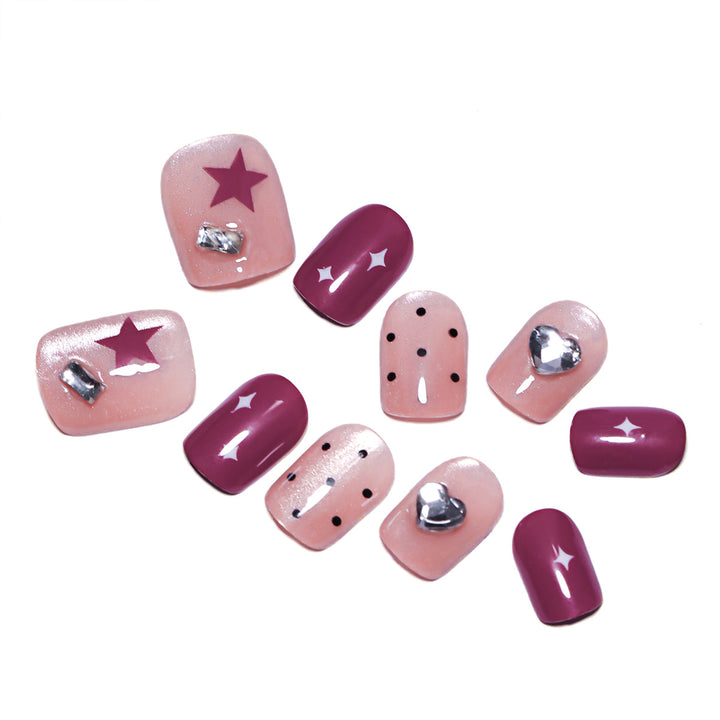 Artificial nail extensions with unique jewelry accents Kalsten