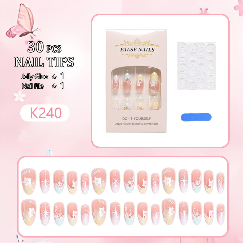 Artificial nail set with intricately detailed floral designs and shine accents Kalsten
