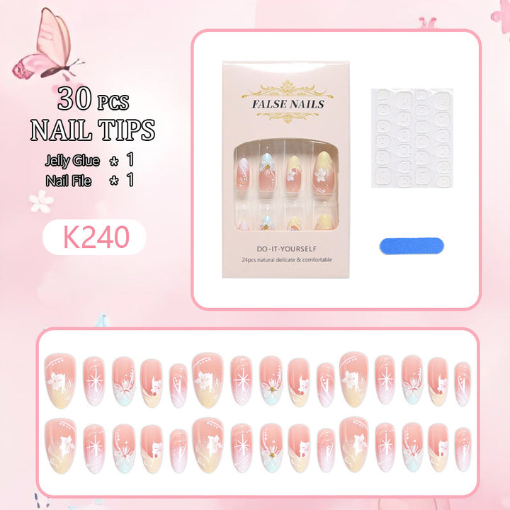 Artificial nail set with intricately detailed floral designs and shine accents Kalsten