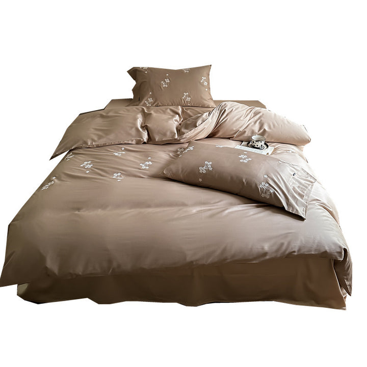 Elegant satin bed linen set with subtle floral embroidery and silk-like sheen