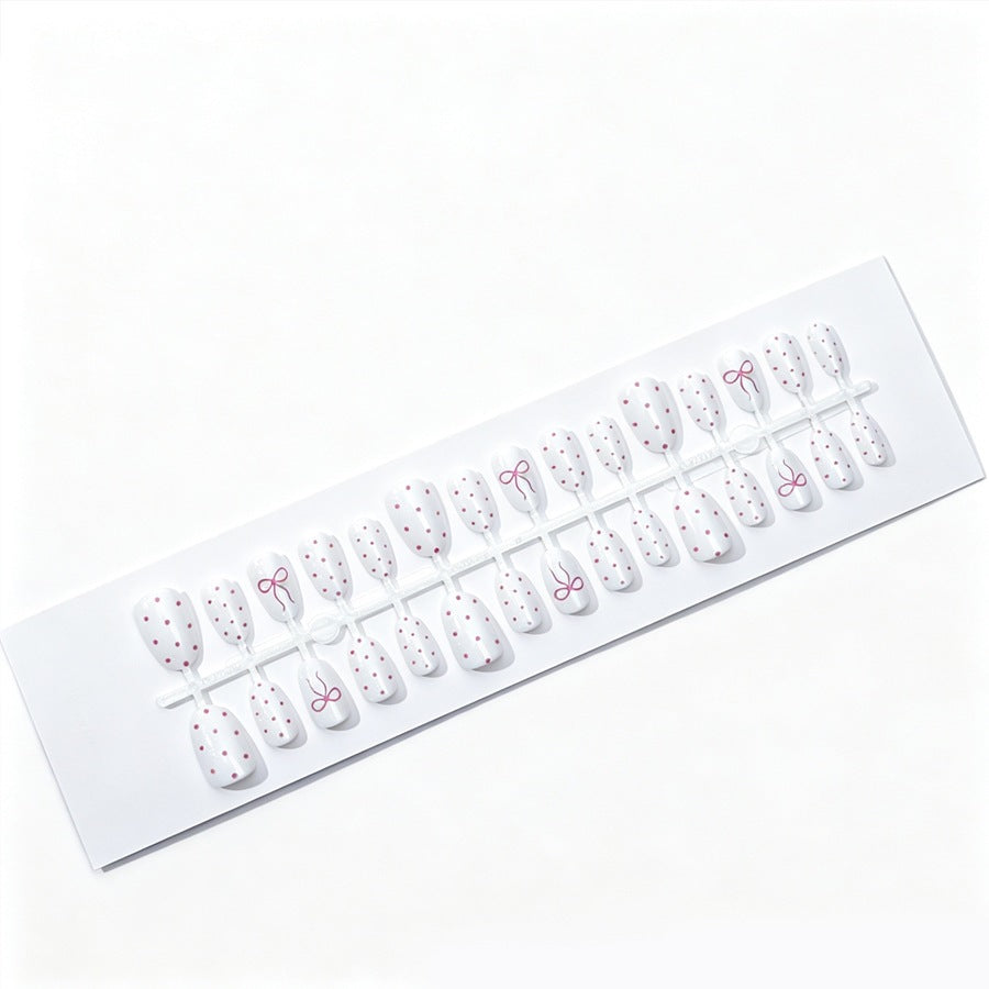 Artificial nail set with delicate dots and bow pattern Kalsten