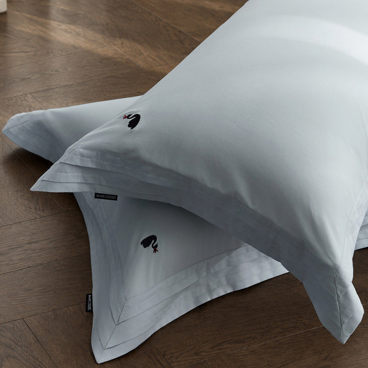 Fine-made duvet cover set made of Mako cotton with subtle monogram embroidery & pleated border