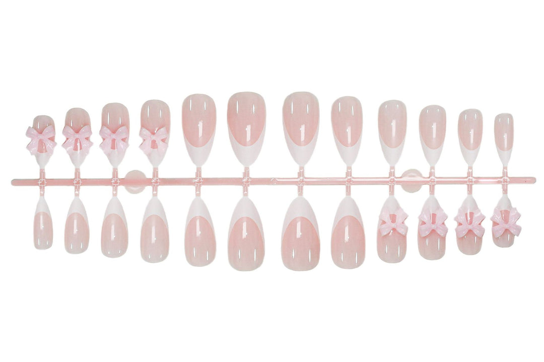 Acrylic nail set with playful bow decorations Kalsten