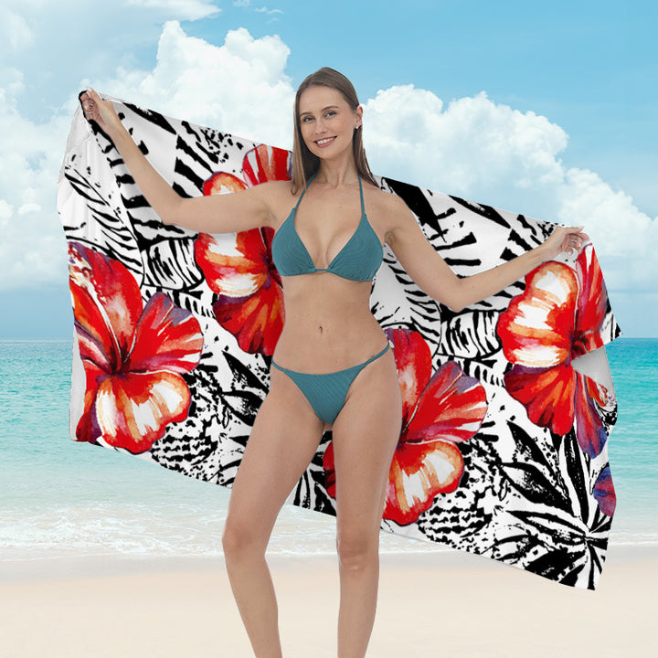 Beach towel with vibrant tropical plant motif Kalsten