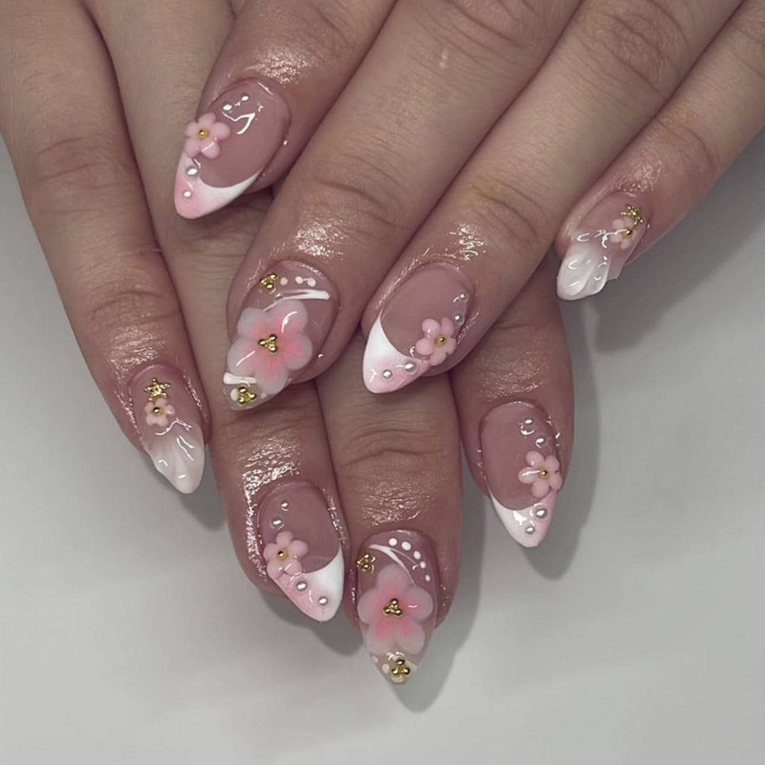 Artful nail extensions with floral patterns and glitter accents Kalsten