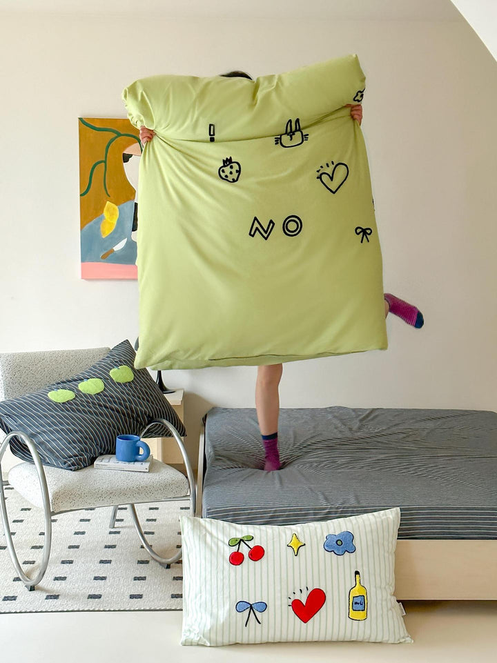 Playful cotton duvet cover set with embroidered motifs and soft fitted sheet