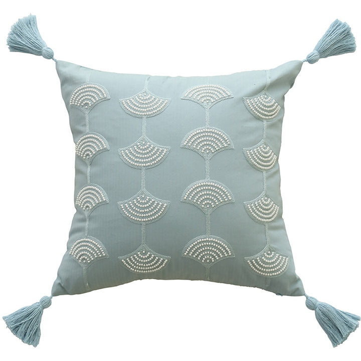 Square decorative pillow with embroidered fan motif and decorative tassels