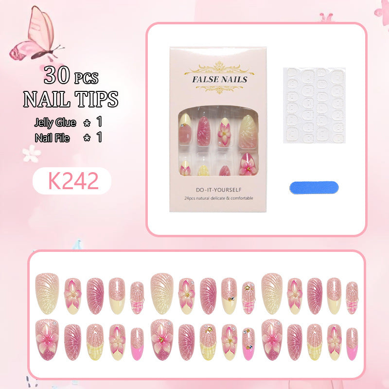 Art nail set with filigree flower decorations and glitter elements Kalsten
