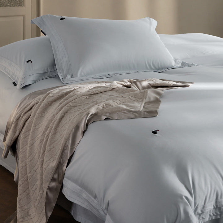 Fine-made duvet cover set made of Mako cotton with subtle monogram embroidery & pleated border