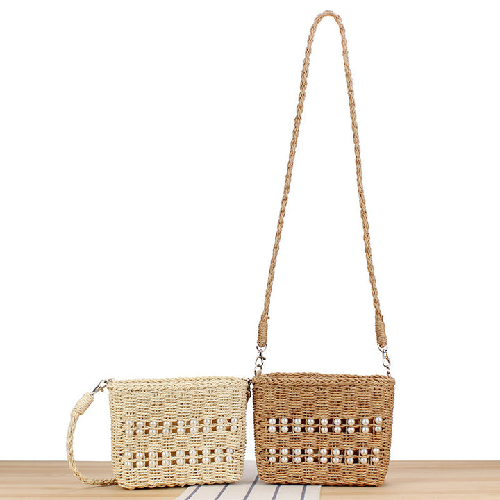 Handbag made of hand-woven natural material with pearl decoration Kalsten