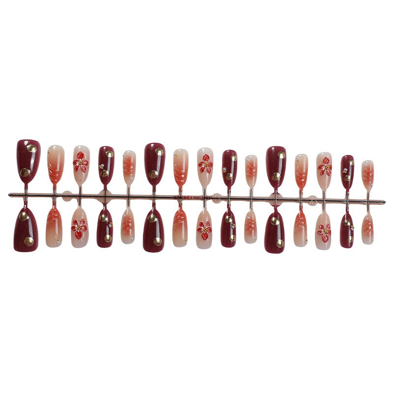 Acrylic nail set with elegant floral accents and glitter details Kalsten