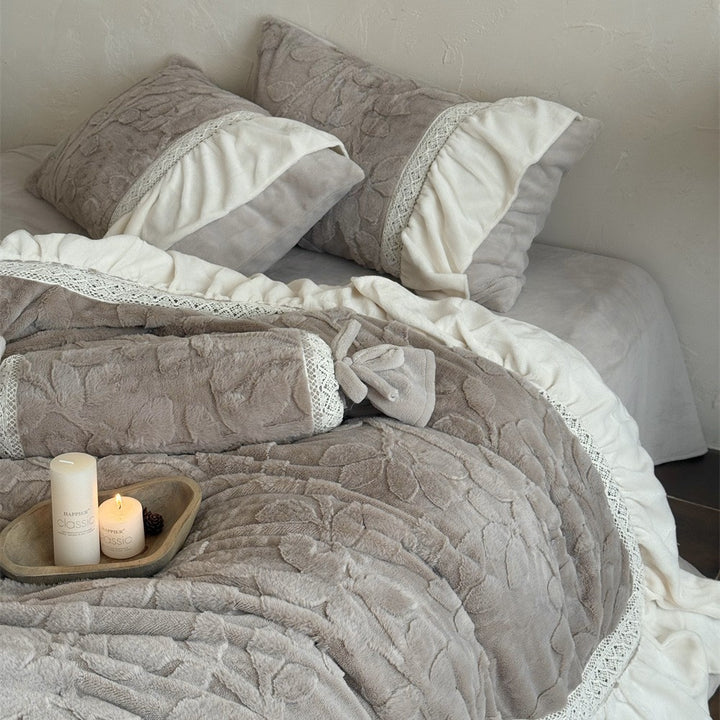 Romantic quilted bedding set with ruffle, floral relief, and neck roll