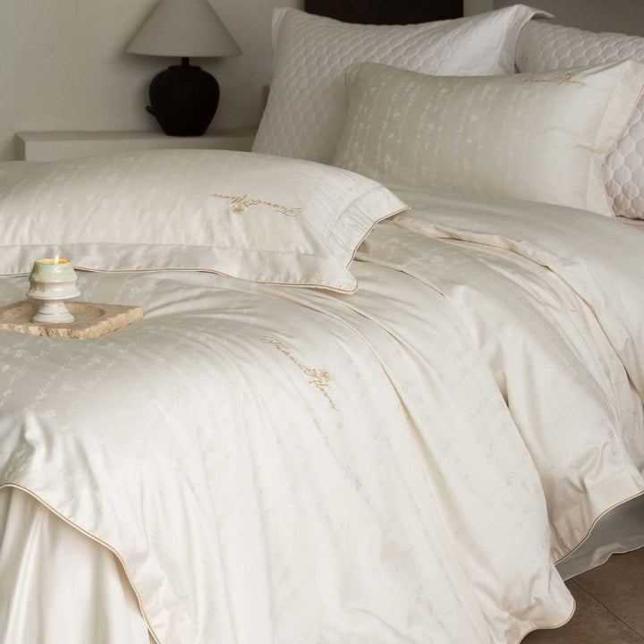 Luxurious satin bedding complete set with quilted cover and delicate logo embroidery