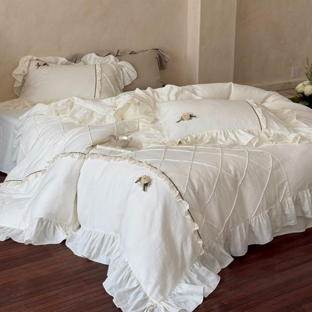 Country house style bedding set with quilted center piece, ruffle and rose appliqué