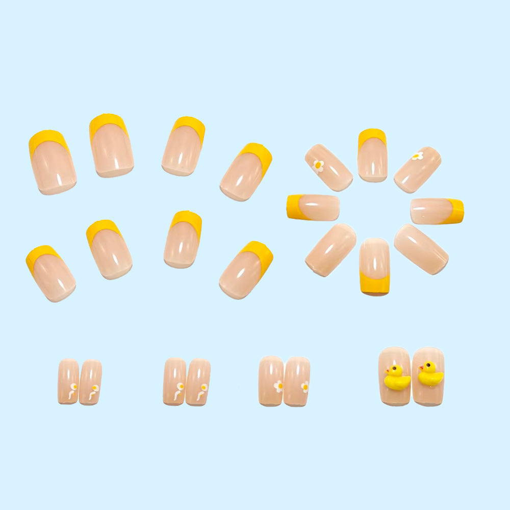 Artificial nails with playful duck motif and spring accents Kalsten