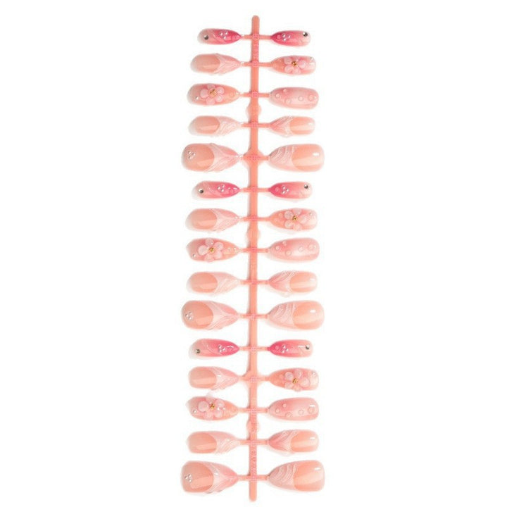 Artificial nail set with delicate floral and glitter accents Kalsten