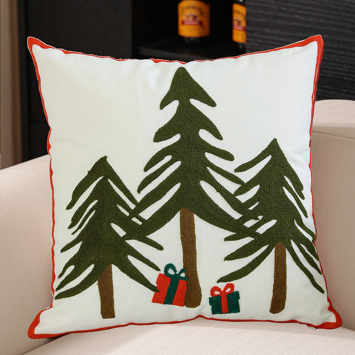 Hand-stitched winter decorative sofa cushion with sled and fir motif
