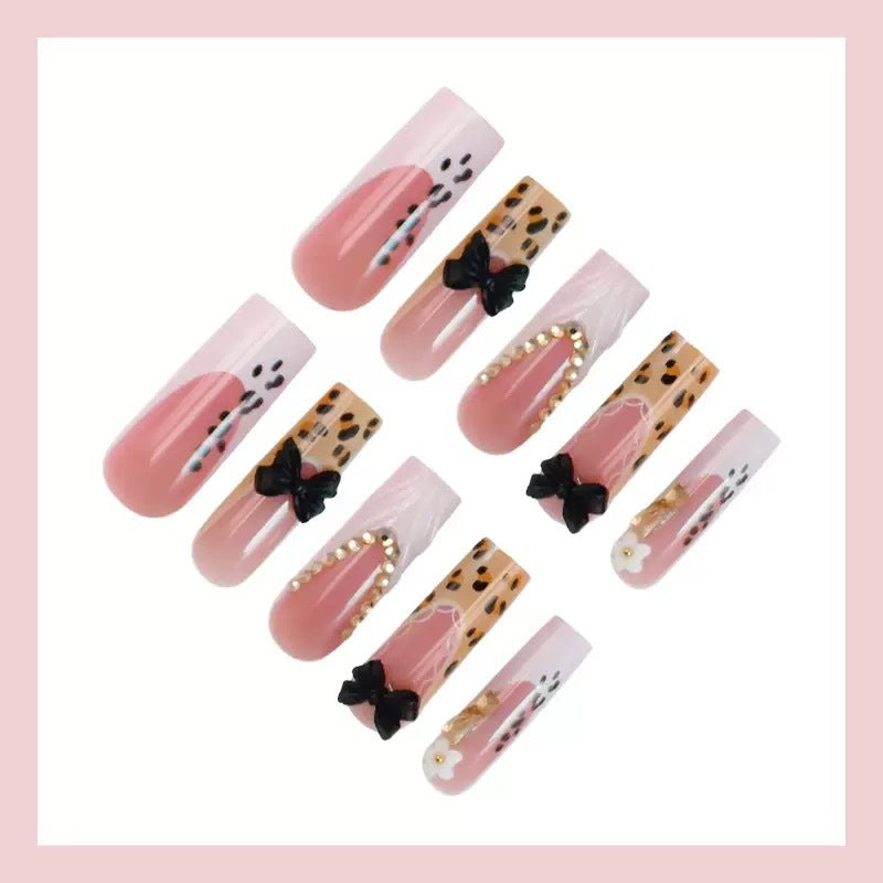Artistic Press-On Nail Design with Bow and Animal Print Accents Kalsten