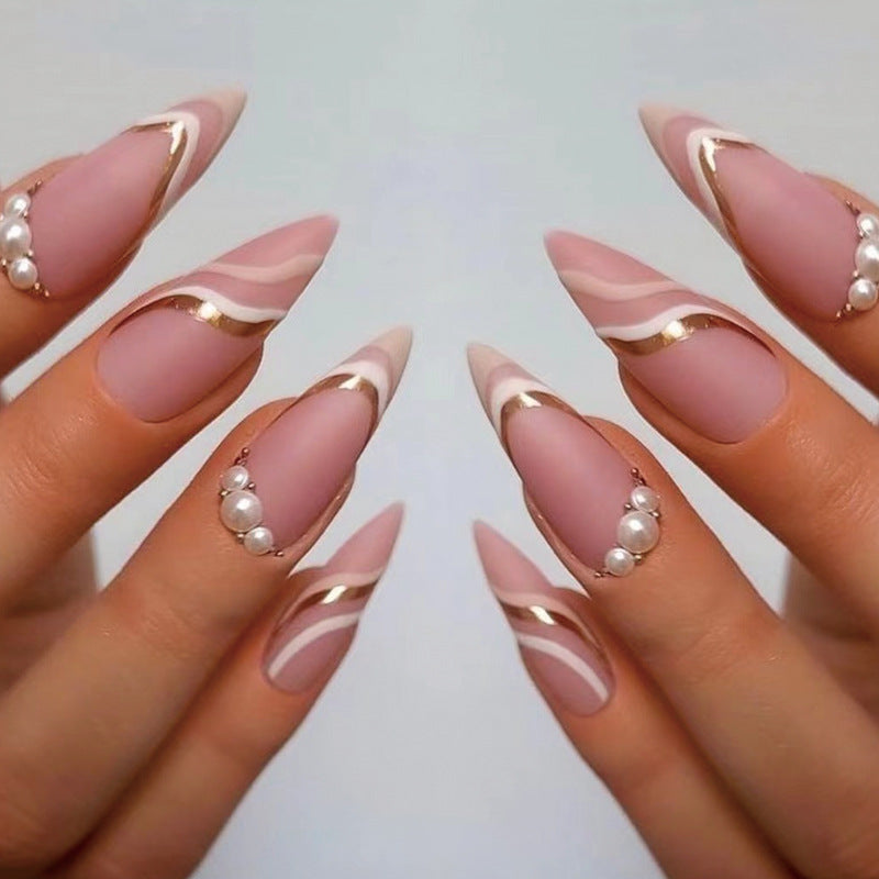 Artful stiletto nails with elegant gold and white accents Kalsten