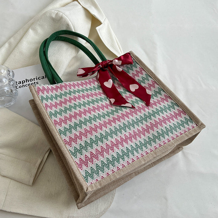 Textured Handbag with Decorative Bow