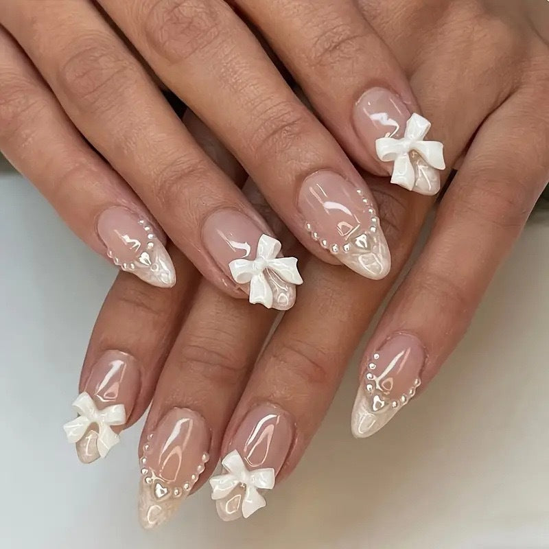 Artistic Press-On Nail Design with Bow Accents Kalsten