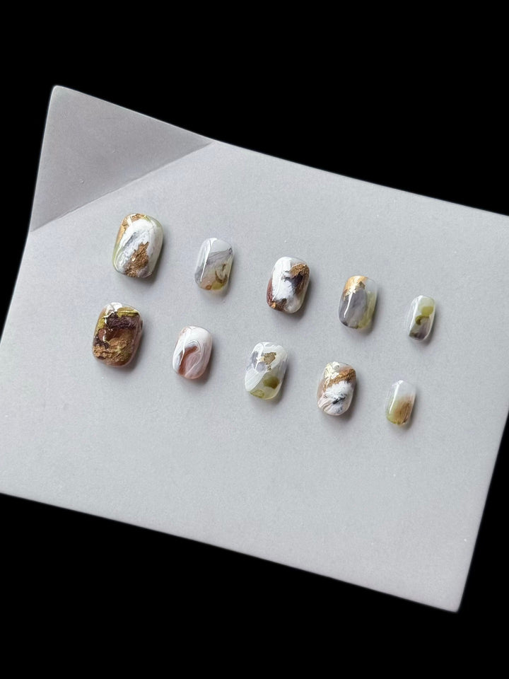 Artistic Press-On Nail Art Set with Marble and Gold Accents
