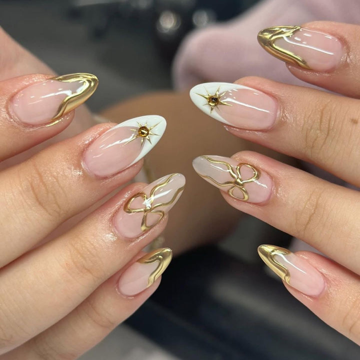 Artistic stiletto nails with elegant gold accents Kalsten